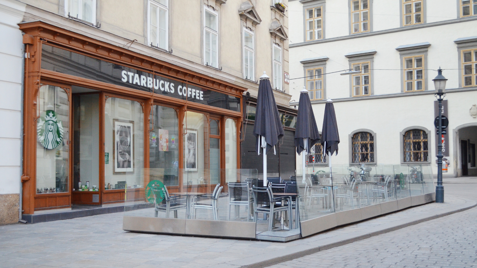 Starbucks Coffee Shop on City Street. 