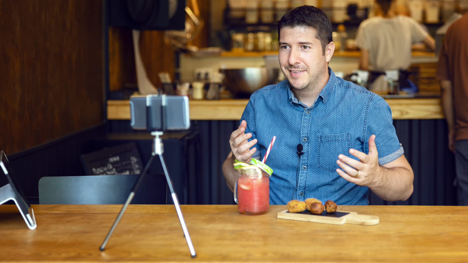Restaurant owners recording himself for a food review. 