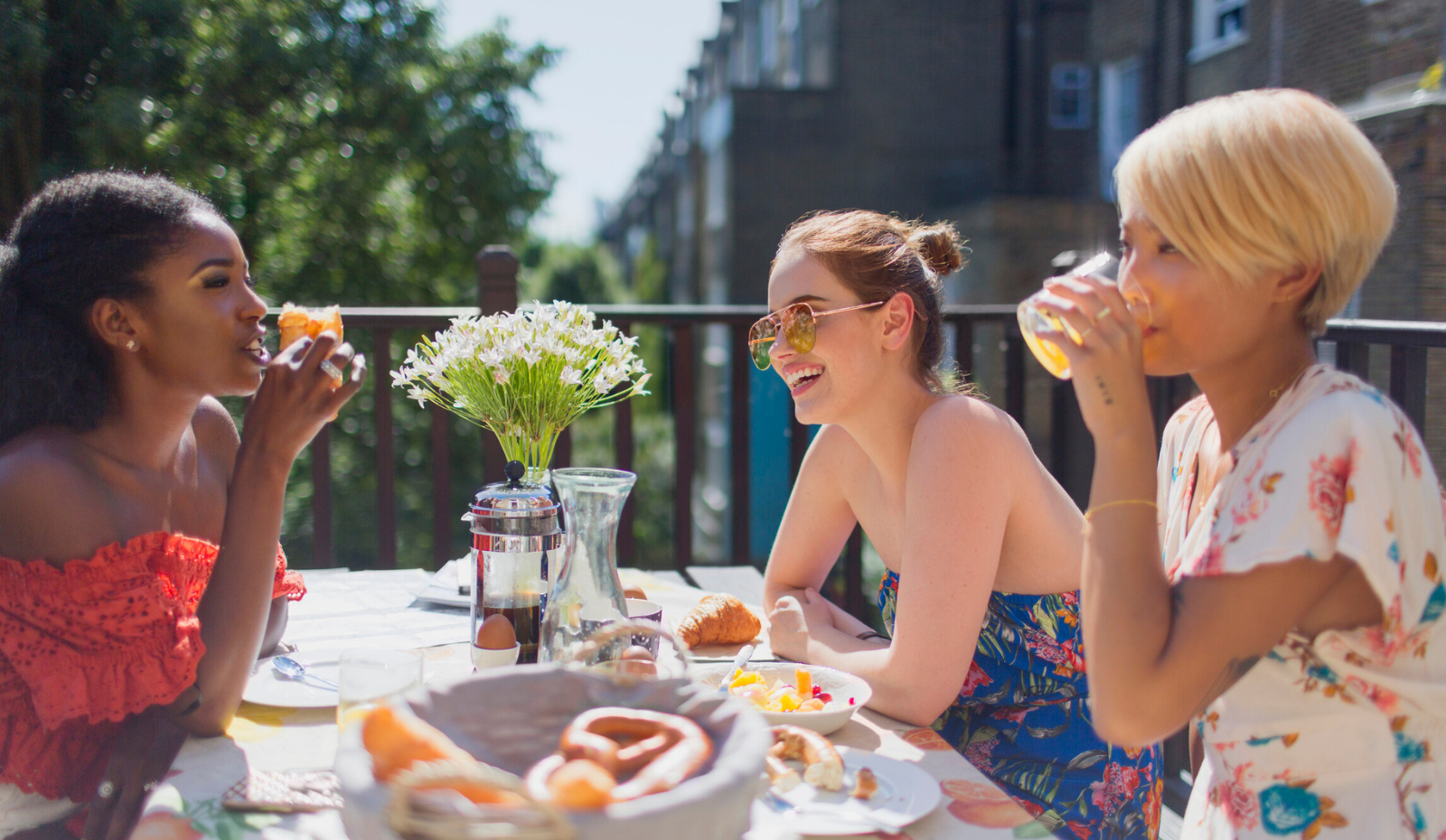 Female friends enjoying brunch outside. 