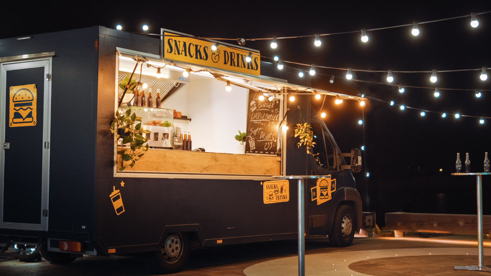 Food truck lit up at night. 